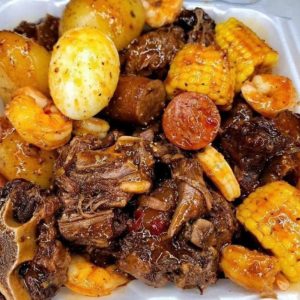 Oxtail bake with potatoes, sausage and carrots